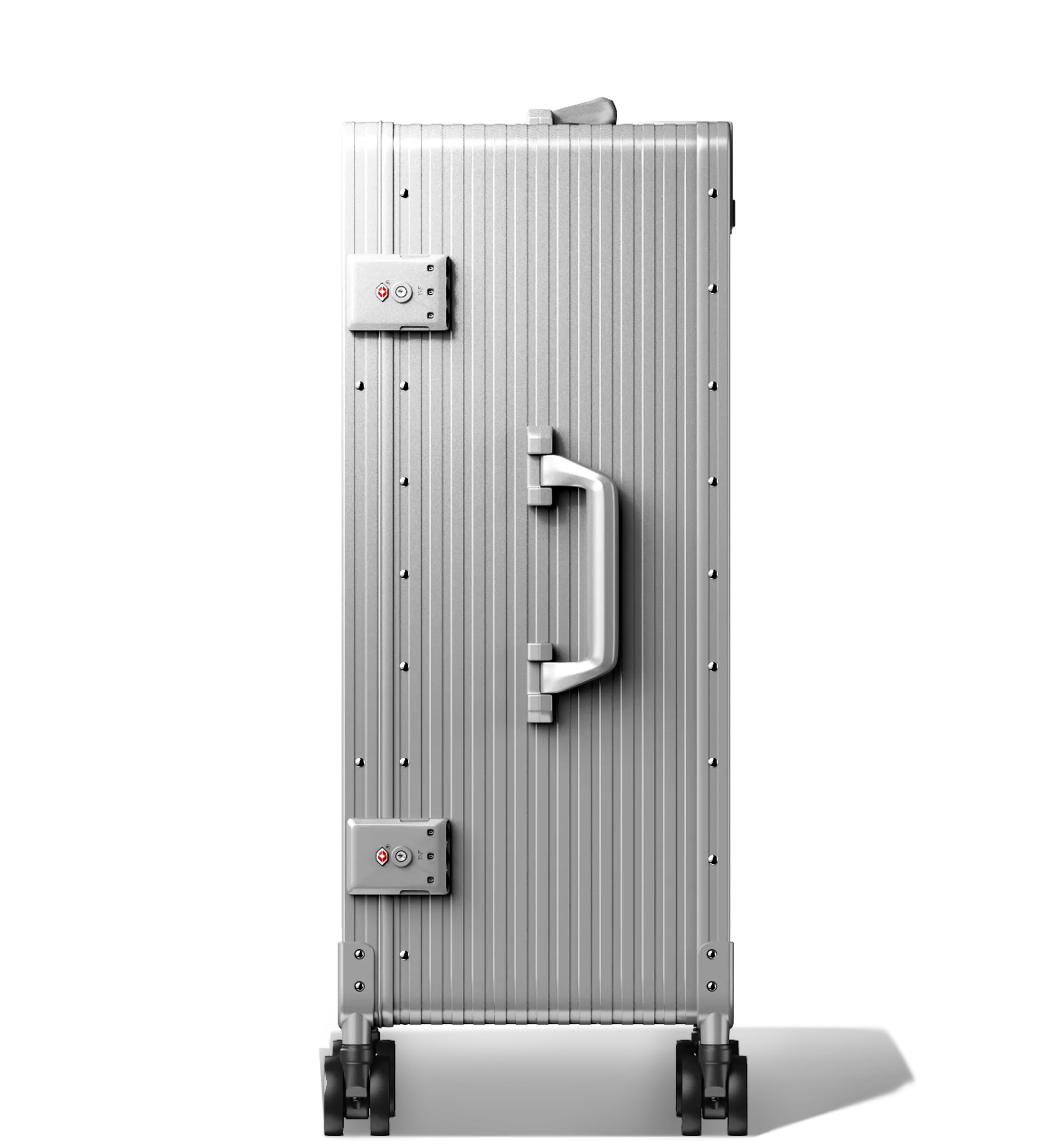 A Silver Check-In 65/25 hard-shell aluminium Luggage standing upright with ribbed texture, side and top carry handles, two TSA-approved combination locks, and four spinning wheels, against a white background.