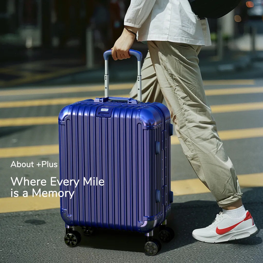 Stylish traveler with blue aluminium luggage on Singapore streets, embodying urban travel chic.